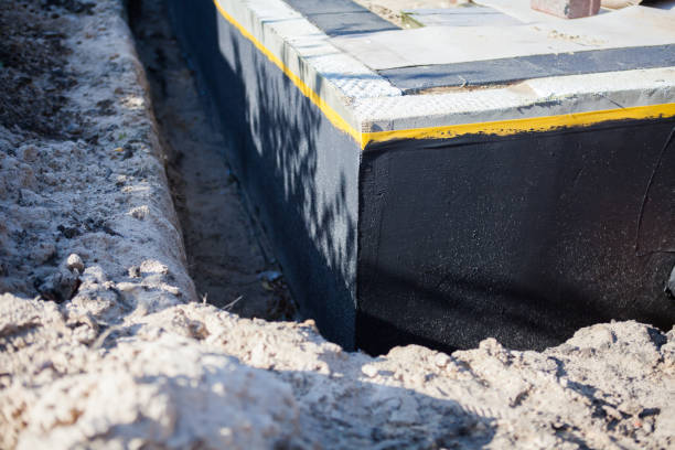Professional Basement Waterproofing technician working in Etna, PA